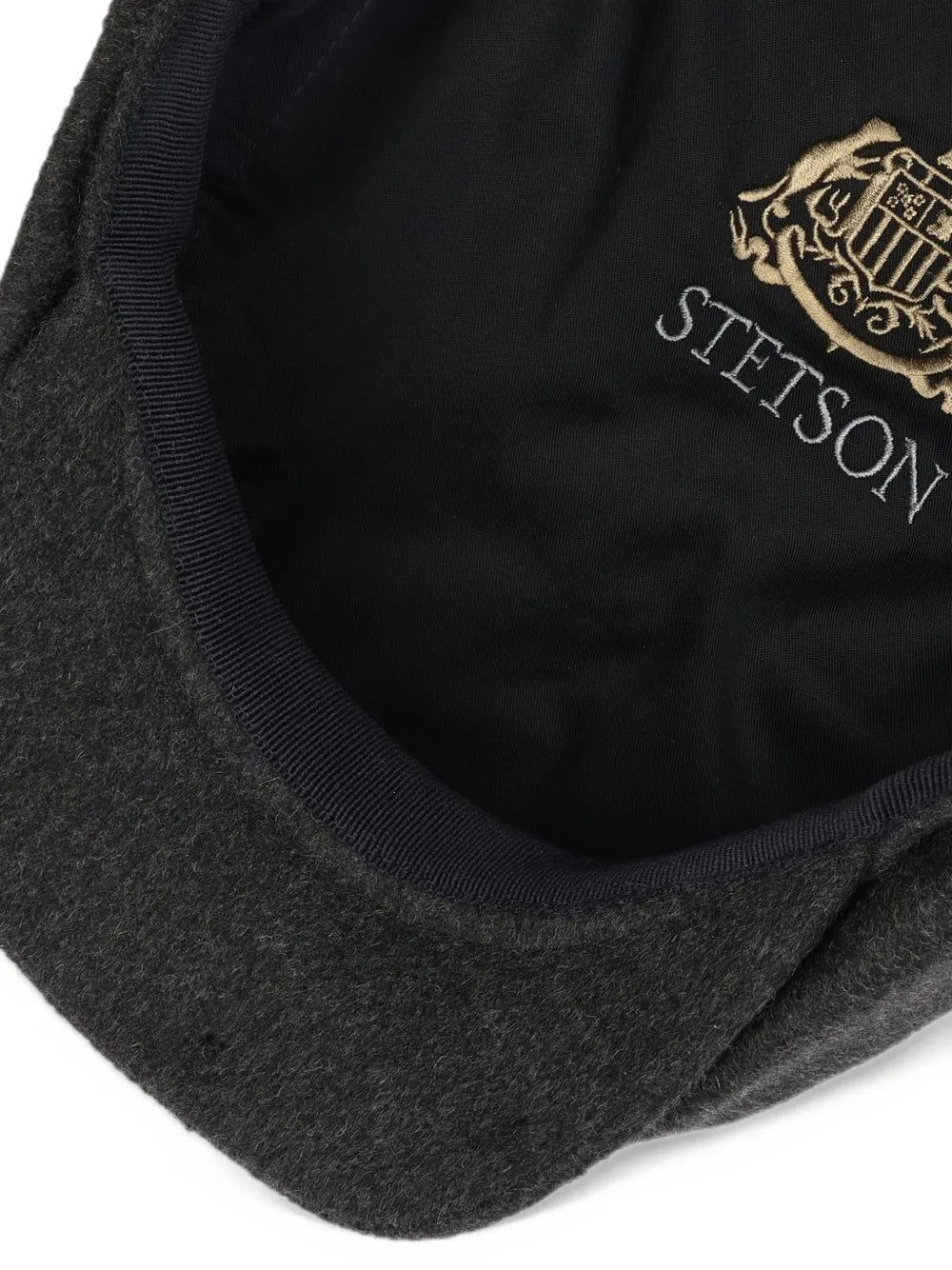 button-topped flat cap